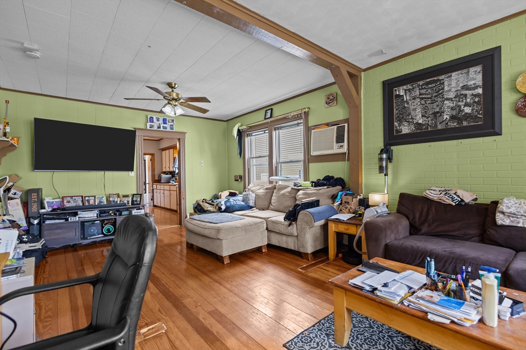 97 Warwick Street Woonsocket, RI 02895 - Photo 8 of 40 a living room with furniture and a flat screen tv