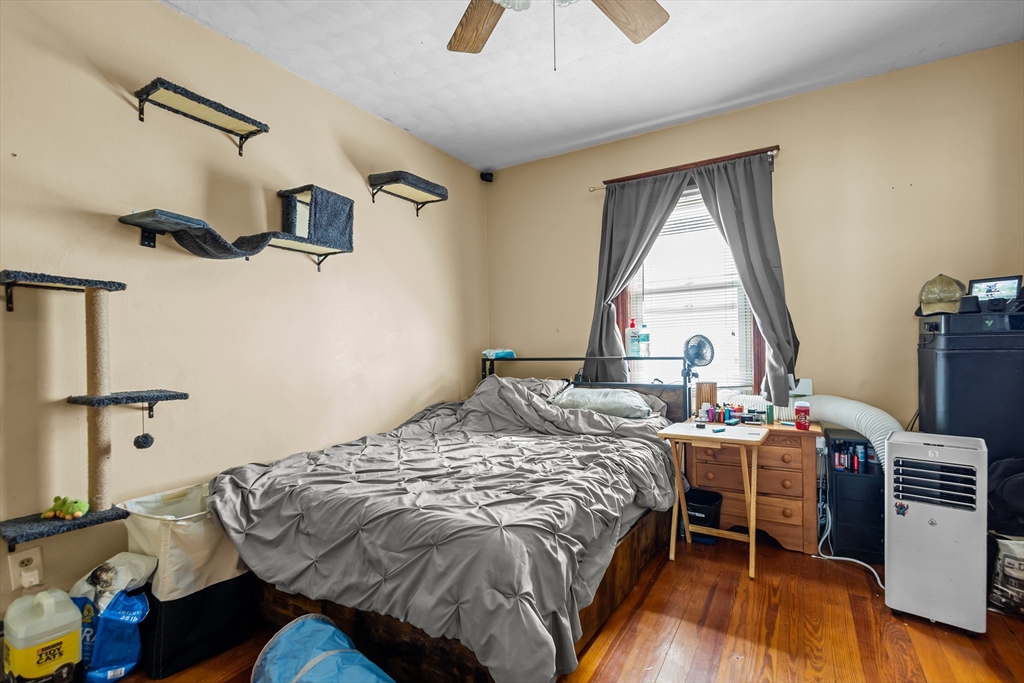 97 Warwick Street Woonsocket, RI 02895 - Photo 10 of 40 a bedroom with a bed and a window