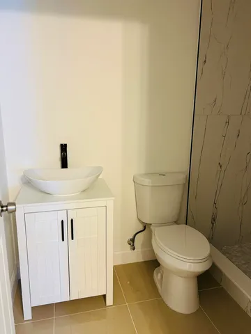 a bathroom with a toilet and a sink