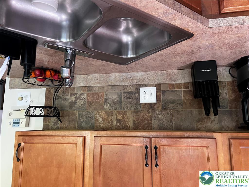 8549 Gateway Road Breinigsville, PA 18031 - Photo 12 of 26 Functional kitchen with a double basin sink and ample cabinetry.