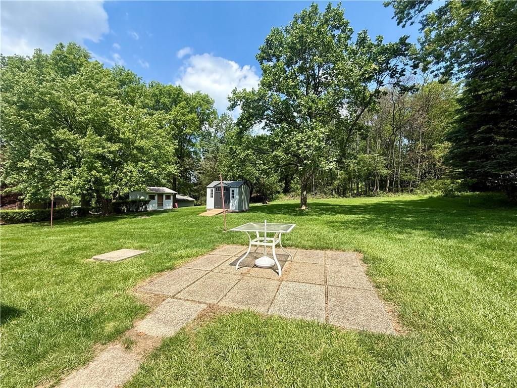 151 Huntingdon Road Wyano, PA 15695 - Photo 5 of 36 a view of a park with plants and large trees