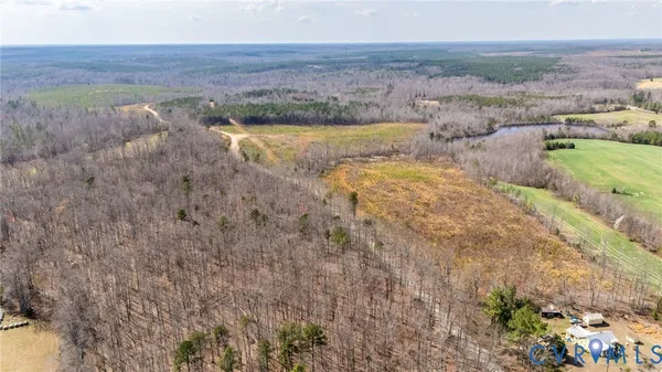 an aerial view of a residential apartment building with a yard