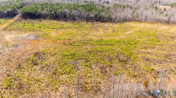 a blue swimming pool is in front of a yard