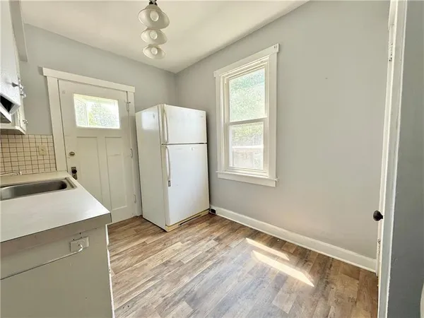 a view of storage and utility room with a window