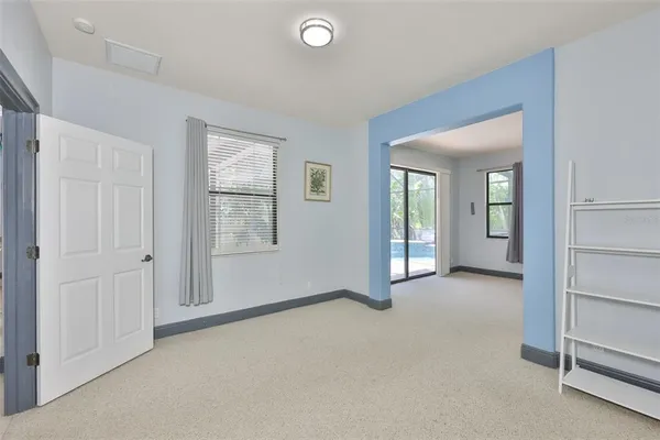 a spacious bedroom with two bed and window