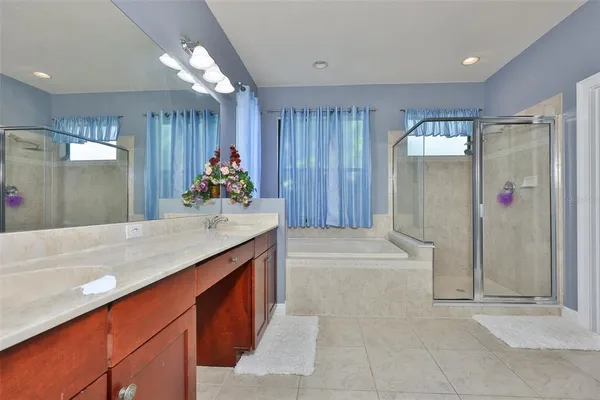a kitchen with stainless steel appliances granite countertop a refrigerator and a stove