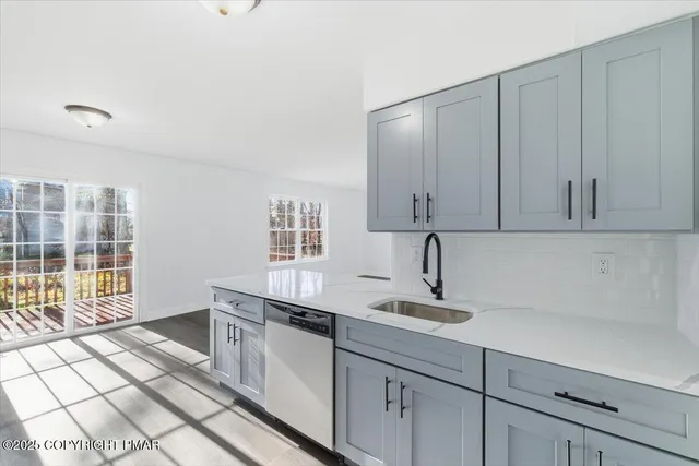 a bathroom with a sink and a window