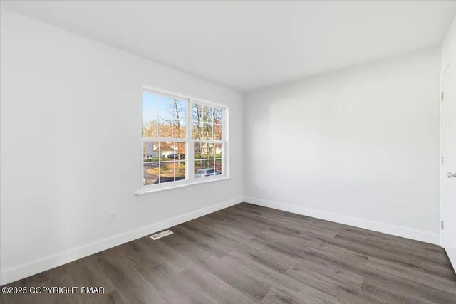 a view of an empty room with stairs