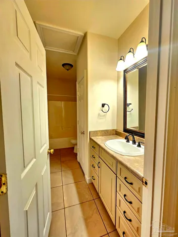 a bathroom with a double vanity sink mirror and a