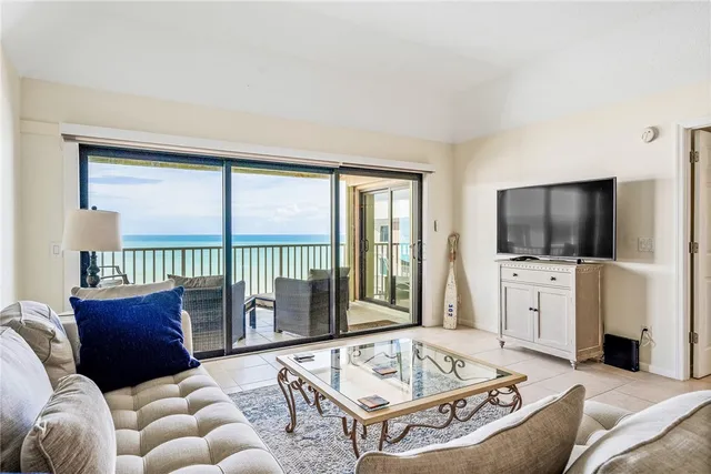 a bedroom with a large bed and a large window