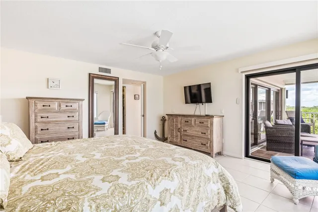 a bathroom with a granite countertop double vanity sink and a mirror