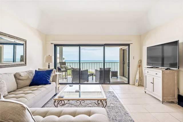 a bed room with a bed and a chair