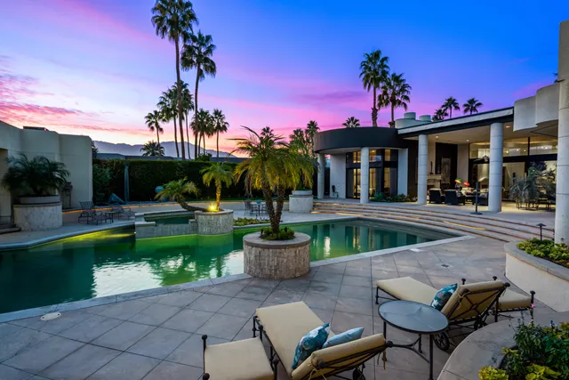 a view of a chairs and table in the patio