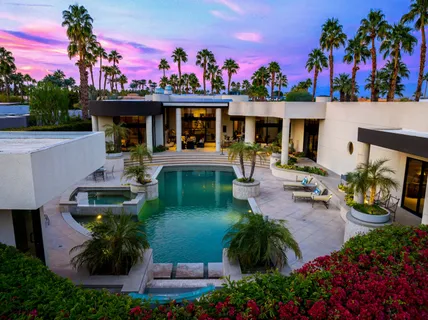 a view of a swimming pool with a patio