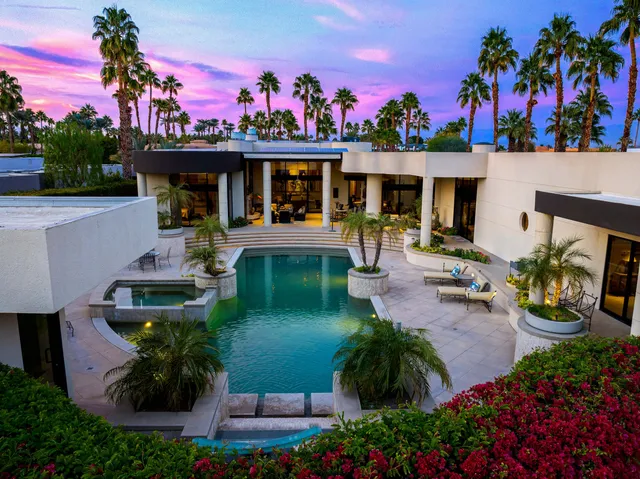 a view of a swimming pool with a patio