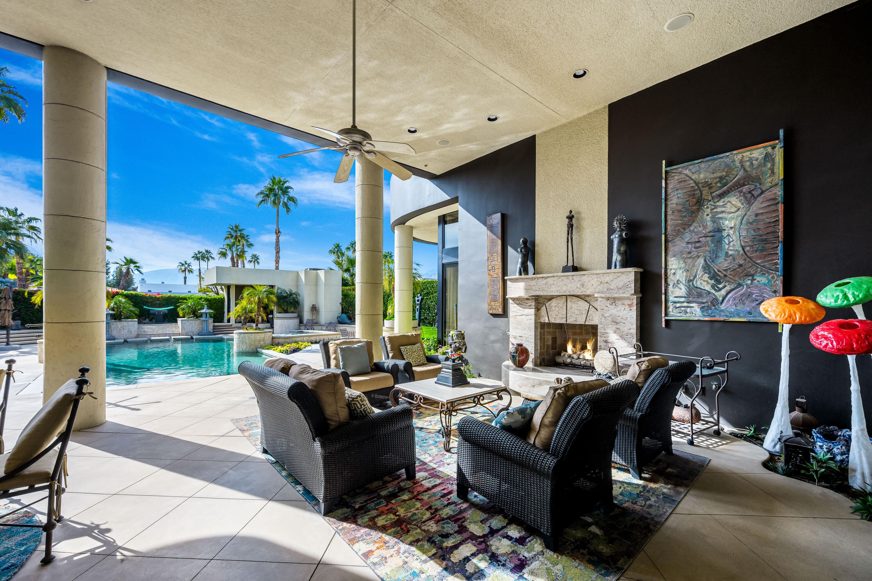 23 Stephen Terrace Rancho Mirage, CA 92270 - Photo 26 of 104 a living room with fireplace furniture and a floor to ceiling window