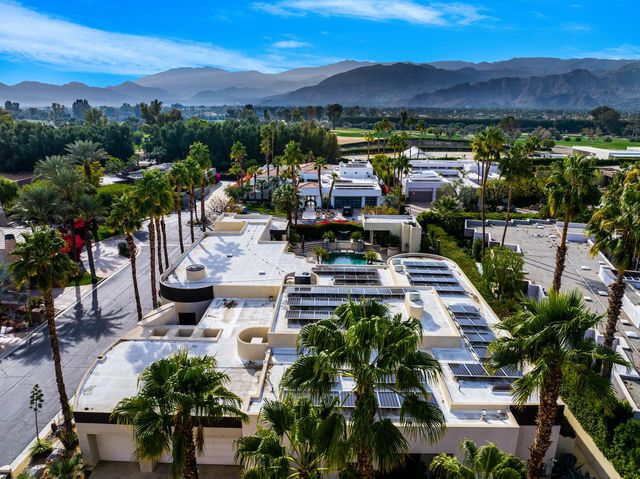 a bedroom with furniture and a fireplace