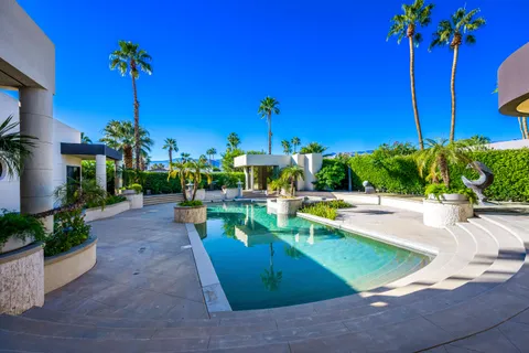 a view of a swimming pool with a patio