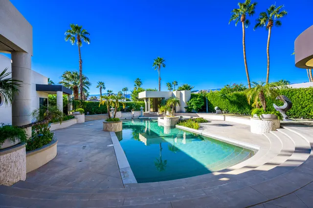 a view of a swimming pool with a patio