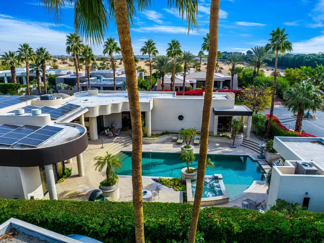 a view of a swimming pool with a patio