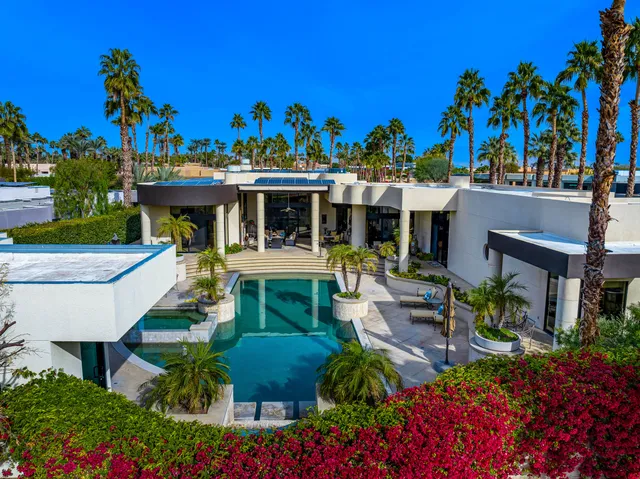 a view of a swimming pool with a patio