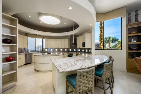 a view of a swimming pool with a patio