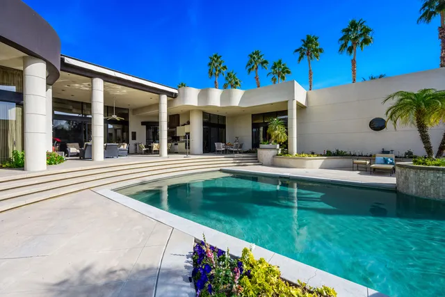 a view of a swimming pool with a patio