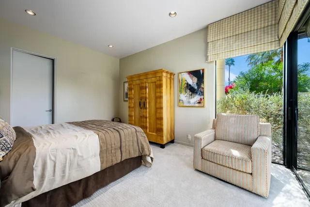 a living room with fireplace furniture and a chandelier