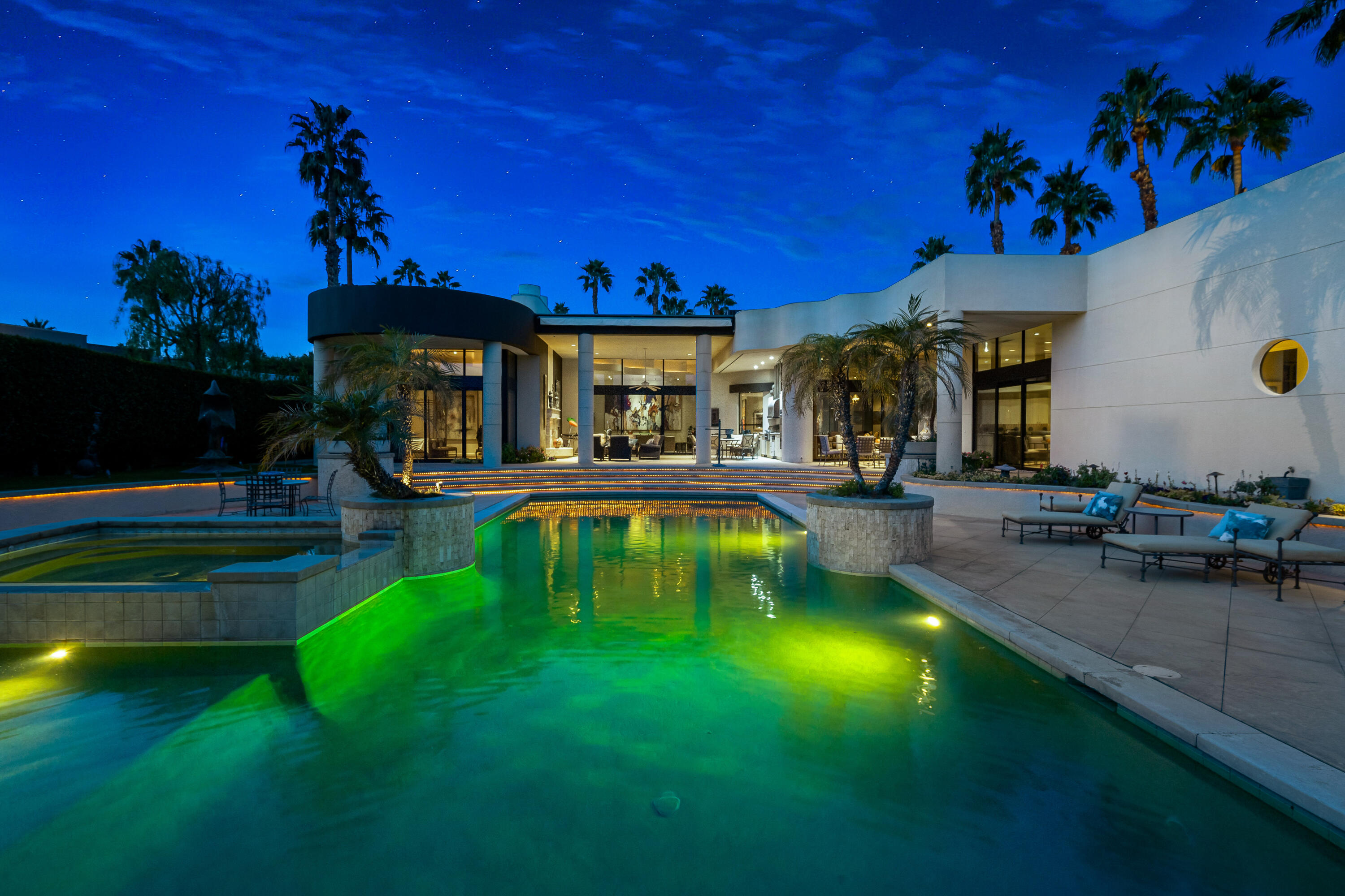 23 Stephen Terrace Rancho Mirage, CA 92270 - Photo 48 of 104 a swimming pool view with a seating space and a garden view