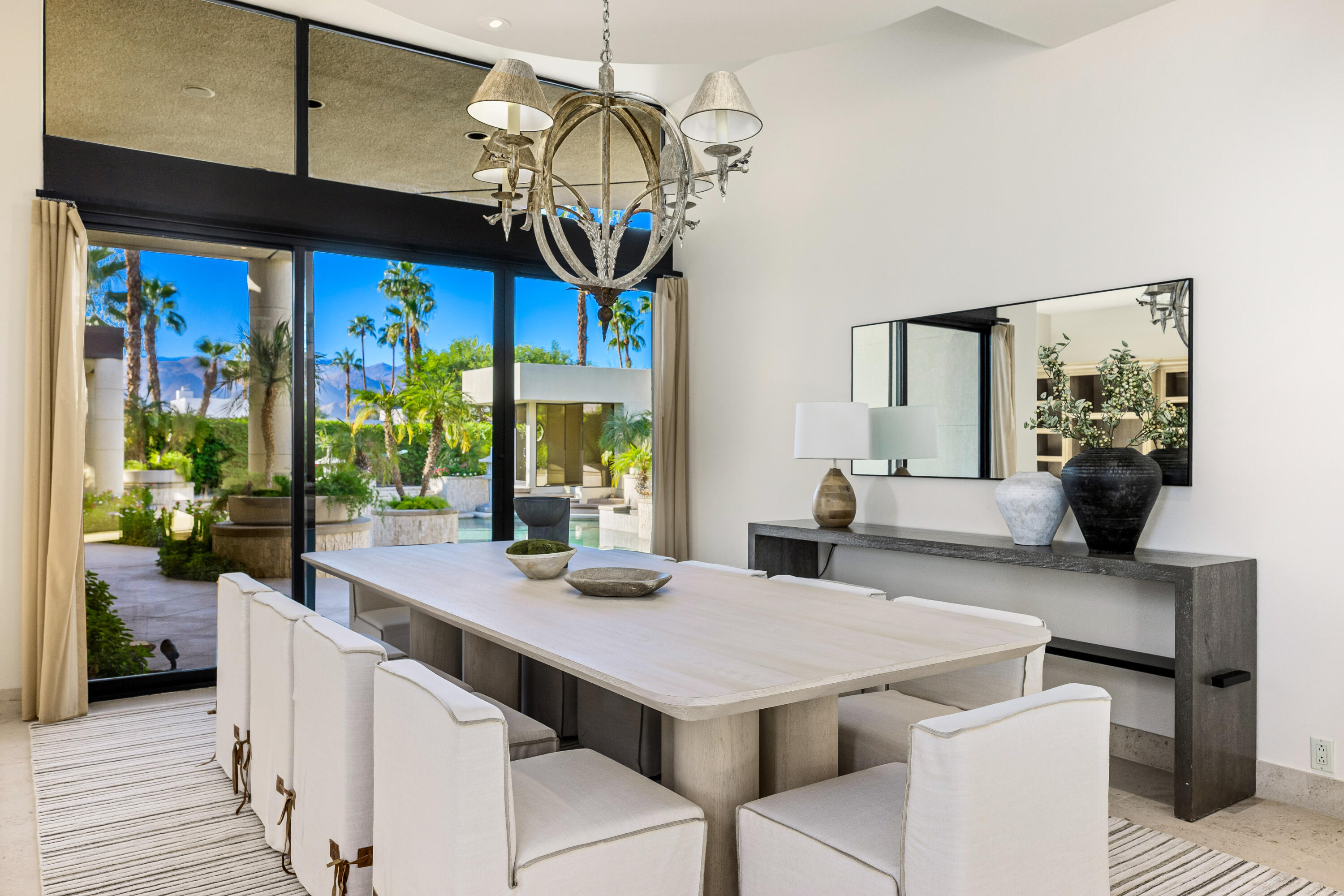 23 Stephen Terrace Rancho Mirage, CA 92270 - Photo 5 of 104 a view of a dining room with furniture a chandelier and large windows