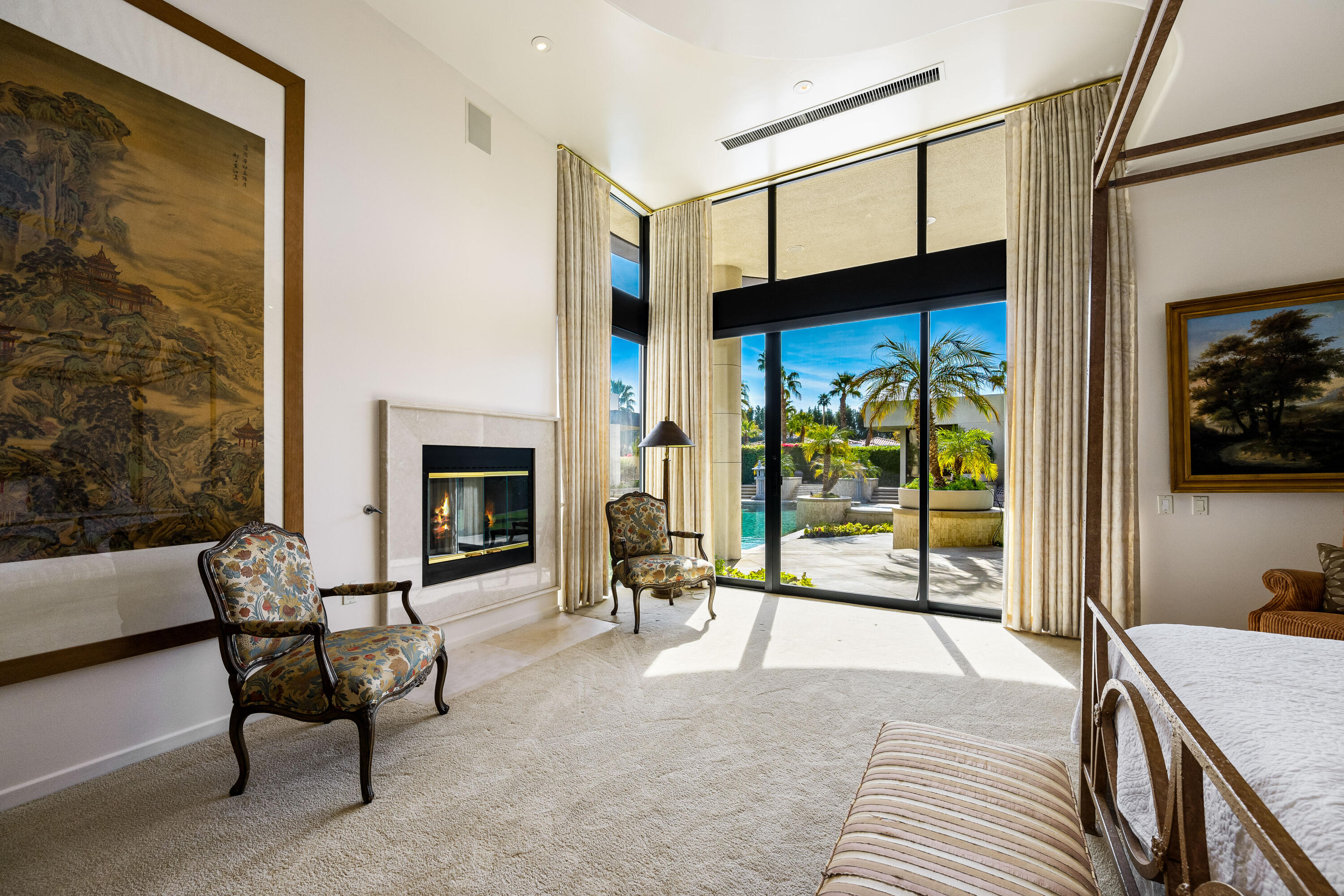 23 Stephen Terrace Rancho Mirage, CA 92270 - Photo 68 of 104 a bedroom with furniture and a fireplace