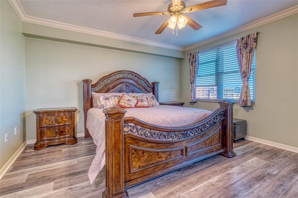 960 Starkey Road, Unit 1502 Largo, FL 33771 - Photo 11 of 36 a living room with furniture a table and wooden floor