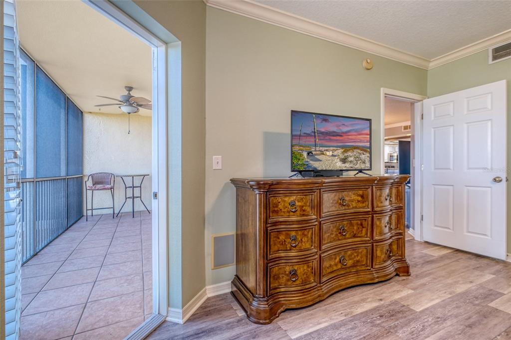 960 Starkey Road, Unit 1502 Largo, FL 33771 - Photo 13 of 36 a view of a dresser with wooden floor