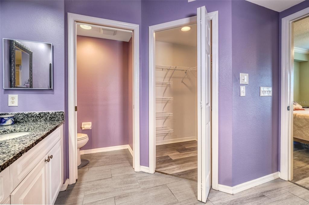 960 Starkey Road, Unit 1502 Largo, FL 33771 - Photo 18 of 36 a bathroom with a granite countertop sink and a mirror