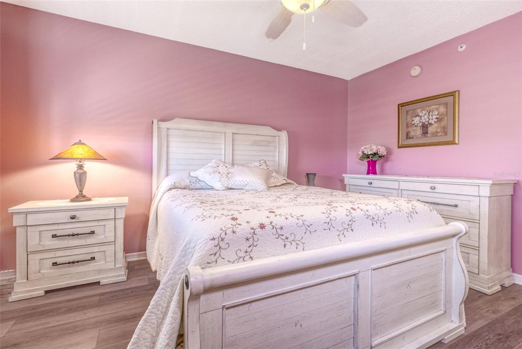 960 Starkey Road, Unit 1502 Largo, FL 33771 - Photo 22 of 36 a bedroom with a bed and a closet