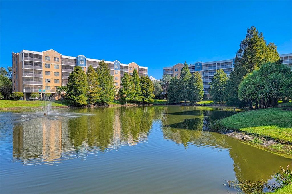 960 Starkey Road, Unit 1502 Largo, FL 33771 - Photo 32 of 36 a view of a lake with a yard next to a lake