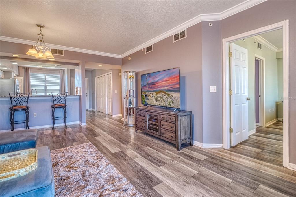 960 Starkey Road, Unit 1502 Largo, FL 33771 - Photo 6 of 36 a view of a livingroom with furniture wooden floor and window
