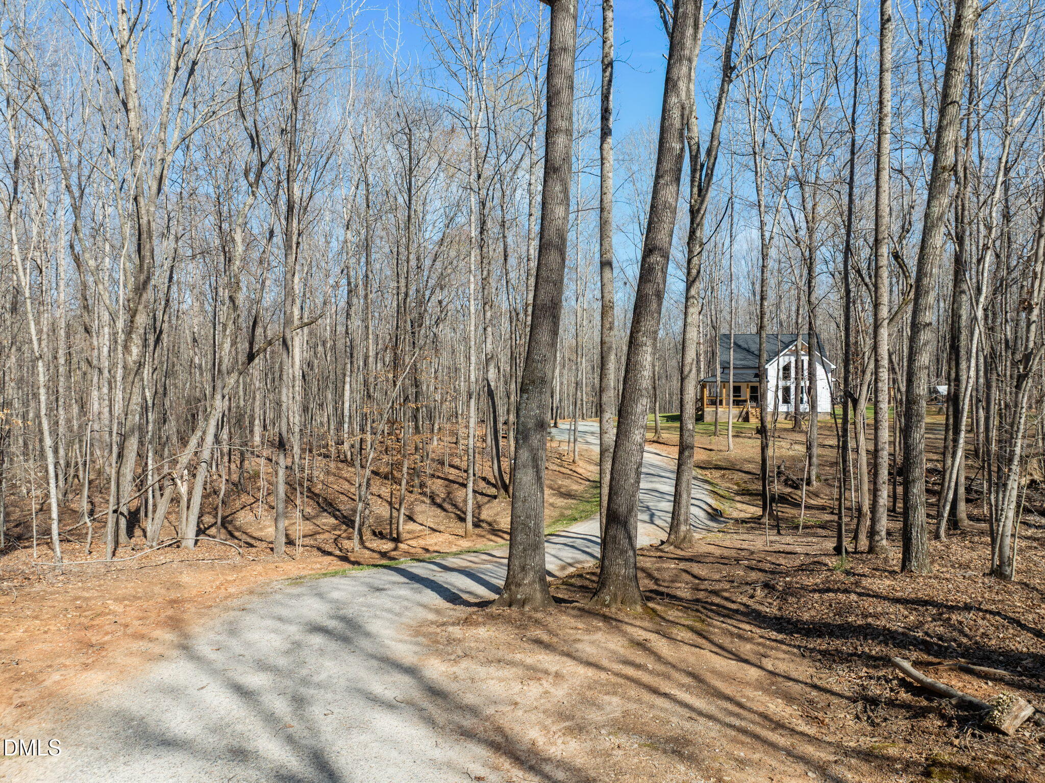 8514 Charlie Stovall Road Roxboro, NC 27574 - Photo 4 of 48 a view of a pathway of a building