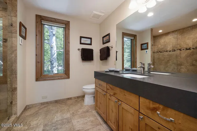 a bathroom with a sink a vanity and a mirror