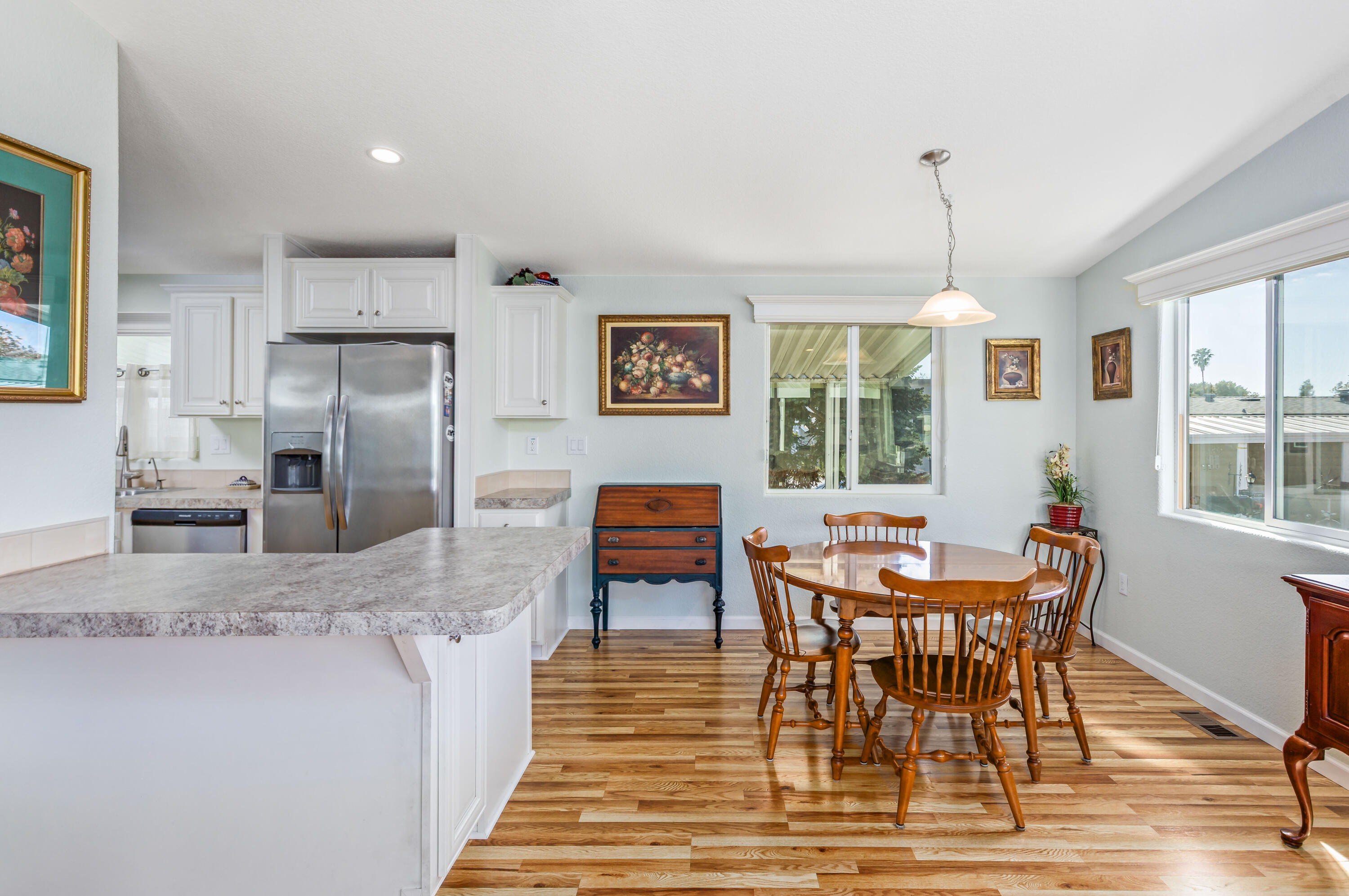 333 Old Mill Road, Unit SPC 66 Santa Barbara, CA 93110 - Photo 7 of 33 a dining room with wooden floor and a window