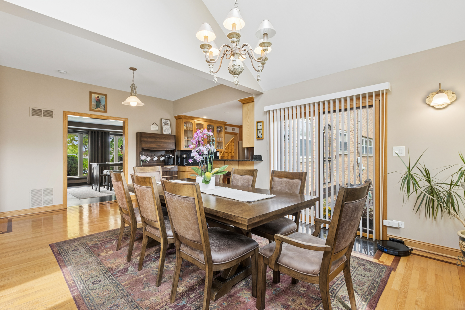 7911 West Rascher Avenue Chicago, IL 60656 - Photo 12 of 39 a dining room with furniture a chandelier and wooden floor