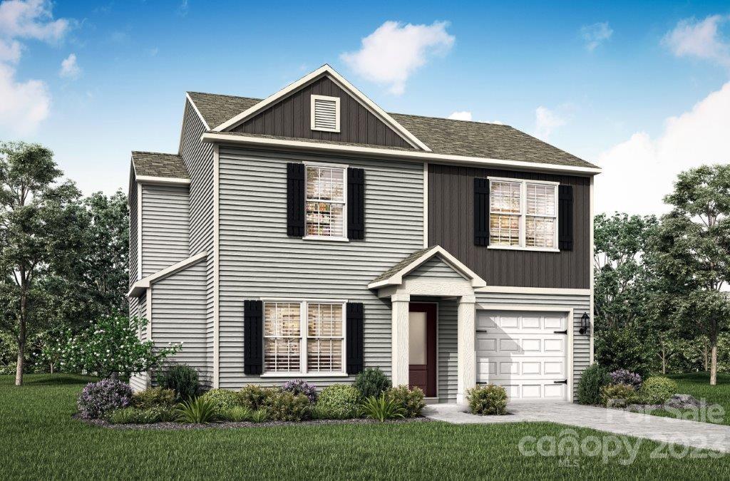 1217 Nia Road Charlotte, NC 28215 - Photo 1 of 3 a front view of a house with a yard