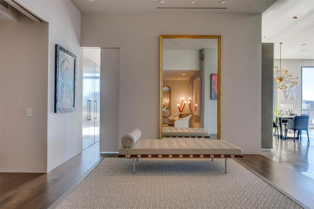 1717 Arts Plaza, Unit 1915 Dallas, TX 75201 - Photo 1 of 31 a living room with furniture and a mirror