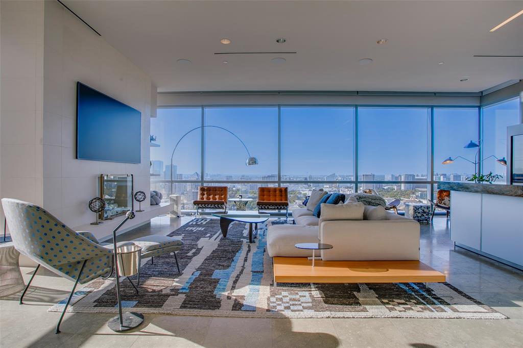 1717 Arts Plaza, Unit 1915 Dallas, TX 75201 - Photo 15 of 31 a living room with furniture a rug and kitchen view