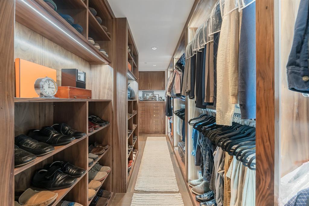 1717 Arts Plaza, Unit 1915 Dallas, TX 75201 - Photo 19 of 31 a view of walk in closet with clothes and shoes