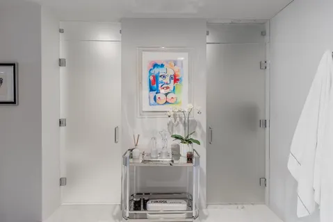 a room with wall paintings and a window