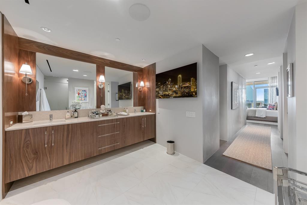 1717 Arts Plaza, Unit 1915 Dallas, TX 75201 - Photo 23 of 31 a large white room with a large mirror and view of living room