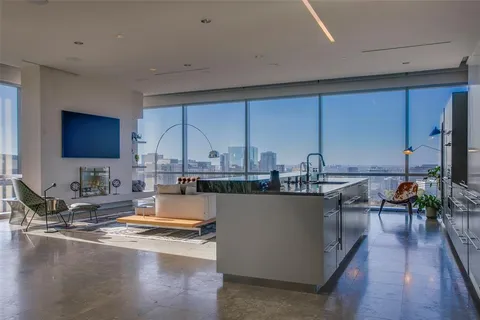 a kitchen with sink and cabinets