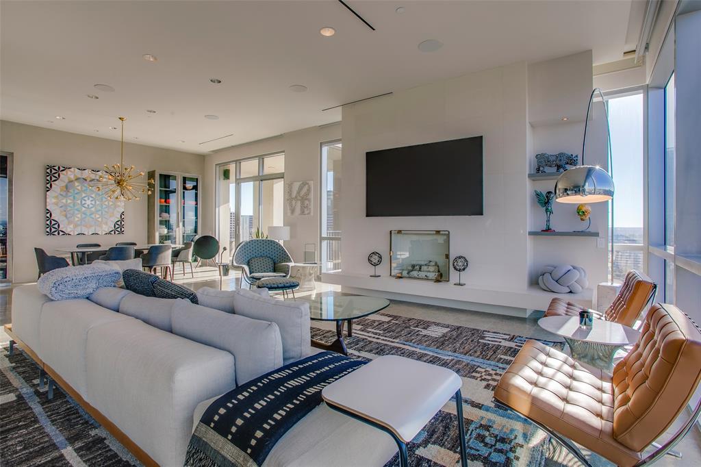 1717 Arts Plaza, Unit 1915 Dallas, TX 75201 - Photo 10 of 31 a living room with furniture a rug and a flat screen tv