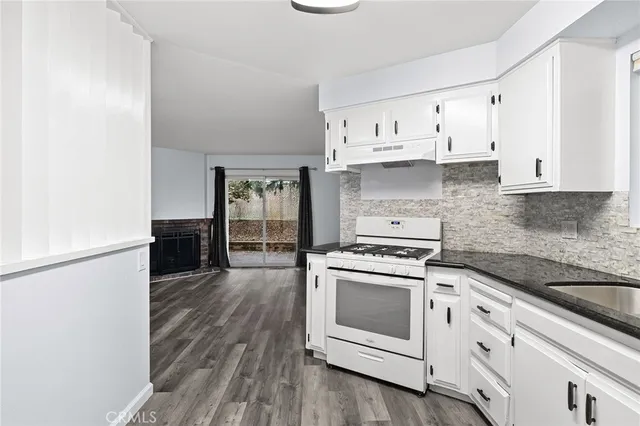 a view of a kitchen from the hallway